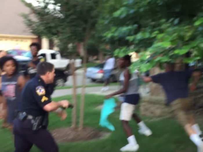 Texas policeman suspended after pulling gun on unarmed black teens at pool party