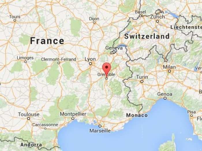 An attacker carrying an Islamist flag reportedly set off explosives and decapitated someone at a factory in France
