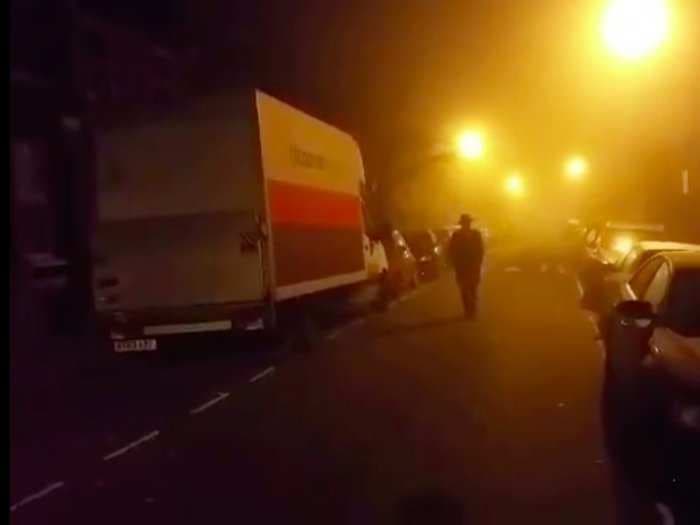 George Galloway slowly walks down a foggy street in his bizarre campaign video