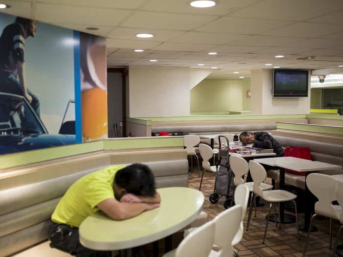 13 heartbreaking images of Hong Kong's 'McSleepers,' homeless people who live in McDonald's