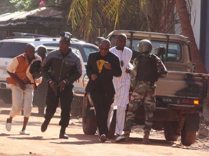 Gunmen have killed 3 people and are holding another 170 hostage in a hotel in Mali