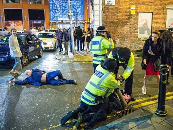 The woman in the red dress from that amazingly beautiful photo of drunken mayhem in Manchester on New Year's Eve explains what actually happened