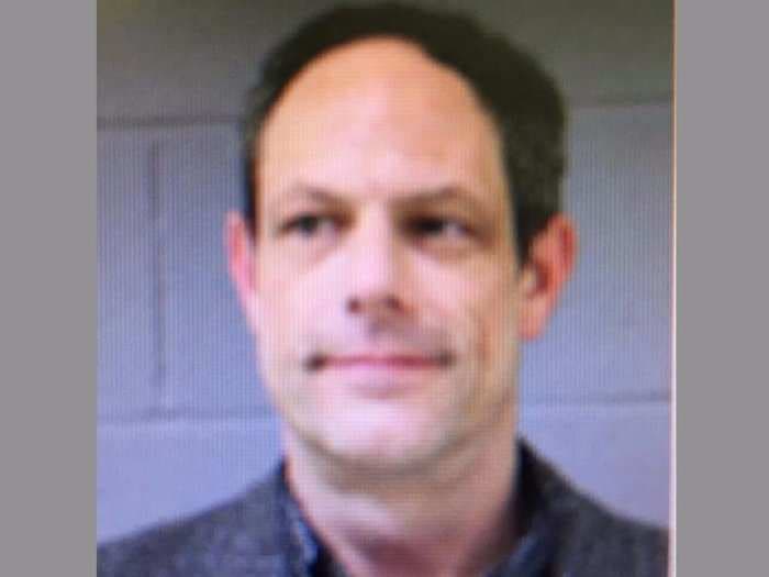 Newtown, Connecticut, middle-school teacher arrested on a charge of bringing a gun to school