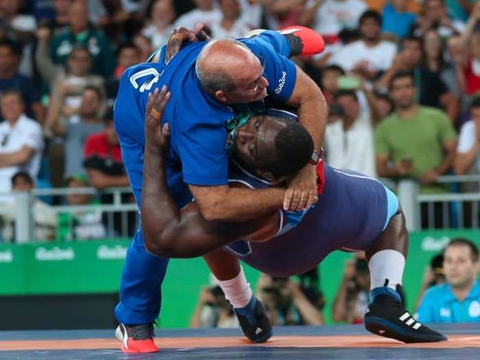 Greco-Roman wrestler celebrated a win by nearly crushing his coach and dancing around the mat