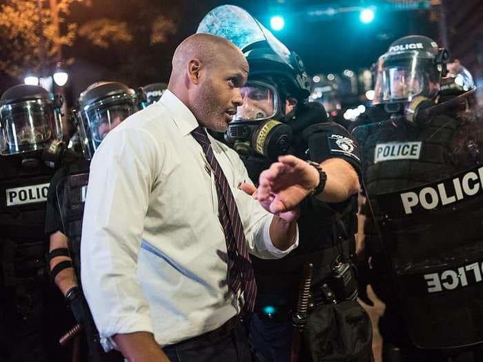 A public defender walking the streets of Charlotte has the most inspirational message for the protesters - and they're listening