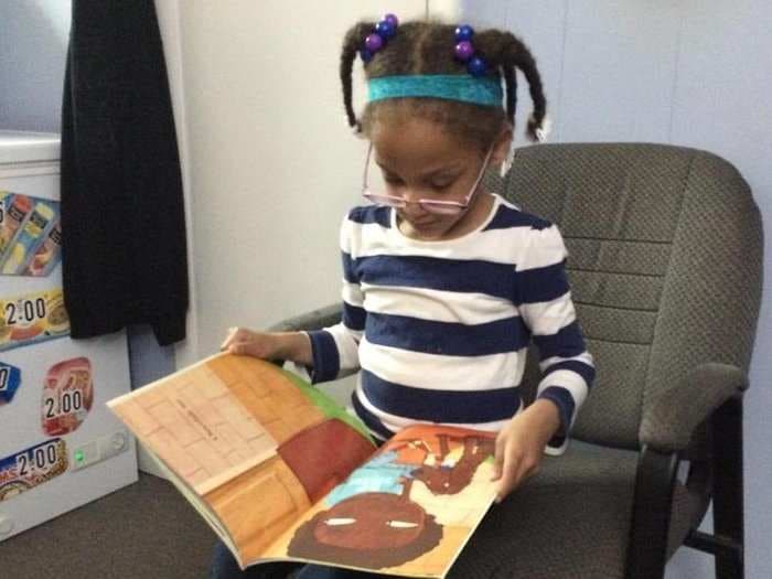 This barbershop pays kids to read out loud while they get their hair cut