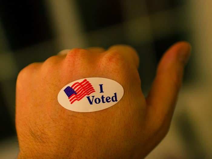 Half of Americans probably won't vote tomorrow - but requiring them would change that