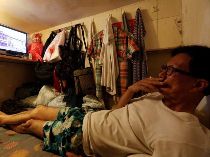 People in Hong Kong are moving into 20-square-foot 'coffin homes' to save money