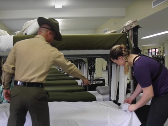 Watch a Marine drill instructor teach a reporter how to make a bed