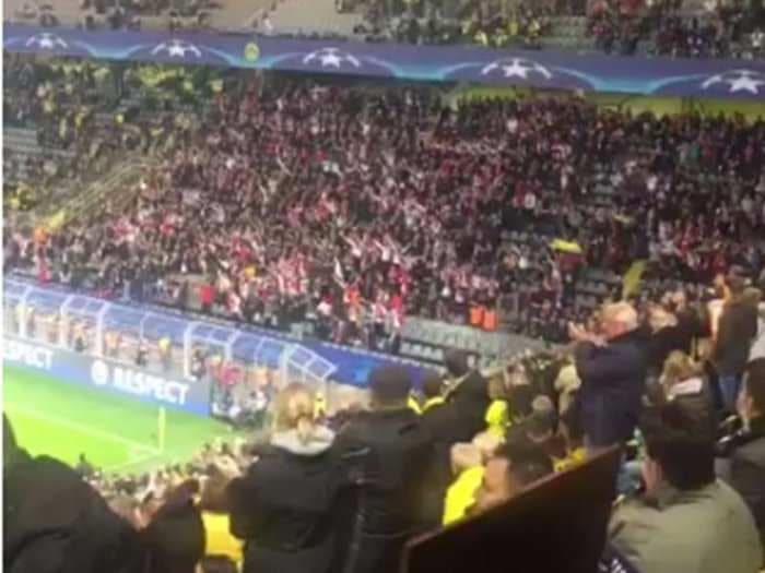 AS Monaco supporters show support for Borussia Dortmund after explosion hits team bus injuring a player