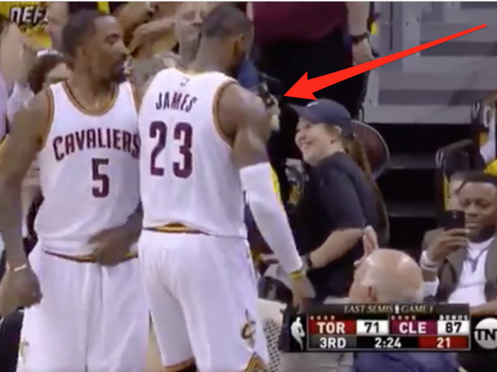 LeBron James pretends to drink fan's beer after getting fouled, doesn't appeared too worried about the Raptors