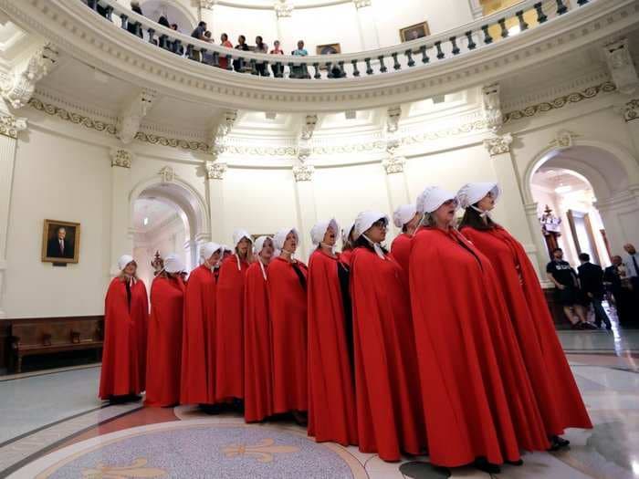 Planned Parenthood staged a 'Handmaiden's Tale'-inspired demonstration on Capitol Hill to protest the healthcare bill