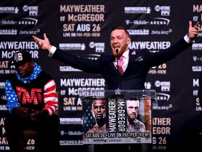 Conor McGregor wore a custom suit to the Mayweather press conference with a vulgar message sewn into it