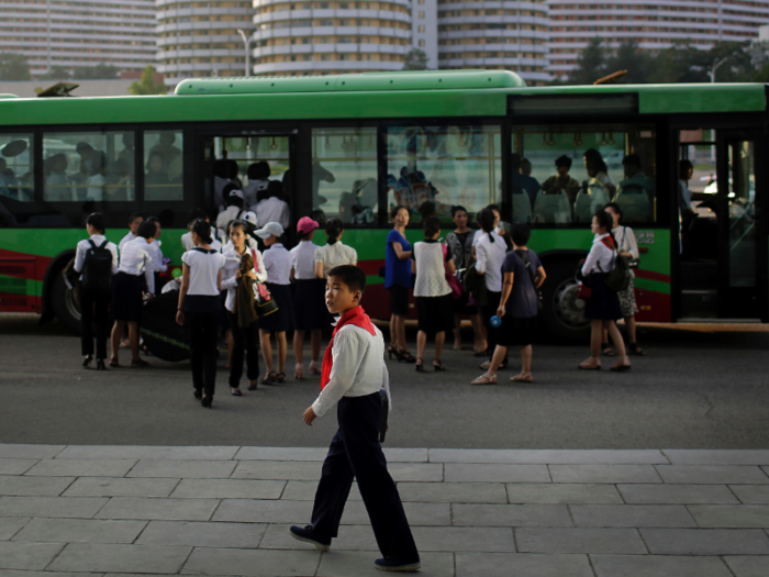 Photographer captures photos of North Koreans' daily life in summertime - and it's bleak