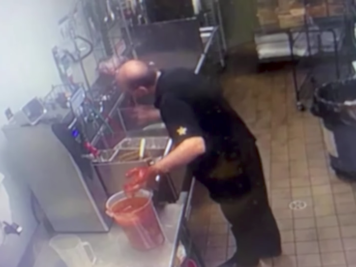 A Carl's Jr. owner was banned from his own kitchen after being caught on camera committing shocking food safety violations