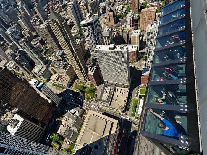 This ride lets you lean out over 1000 feet above Chicago