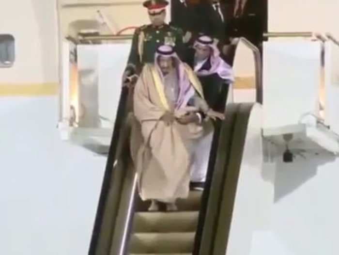 Watch the Saudi king get stuck in midair when his golden escalator breaks down in Russia