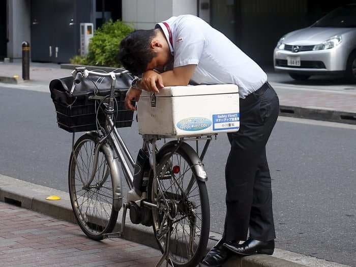 People are working such long hours in Japan that the country now faces a 'death by overwork' problem