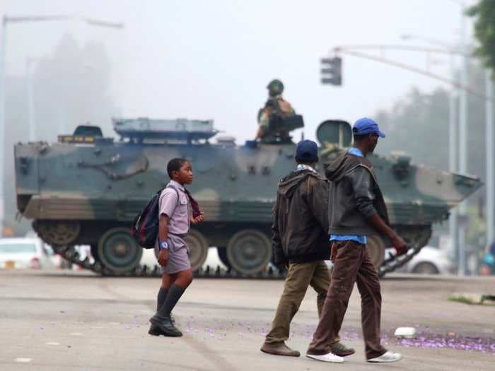 Tanks in the streets and long lines to withdraw money - here's what Zimbabwe looks like under military control