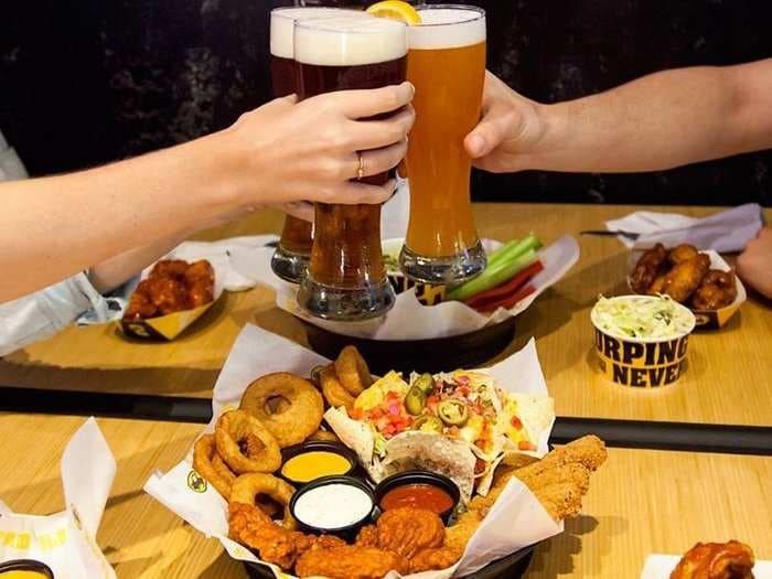 Arby's and Buffalo Wild Wings have joined forces to create a fast-food empire - and the CEO is now considering serving beer at Arby's