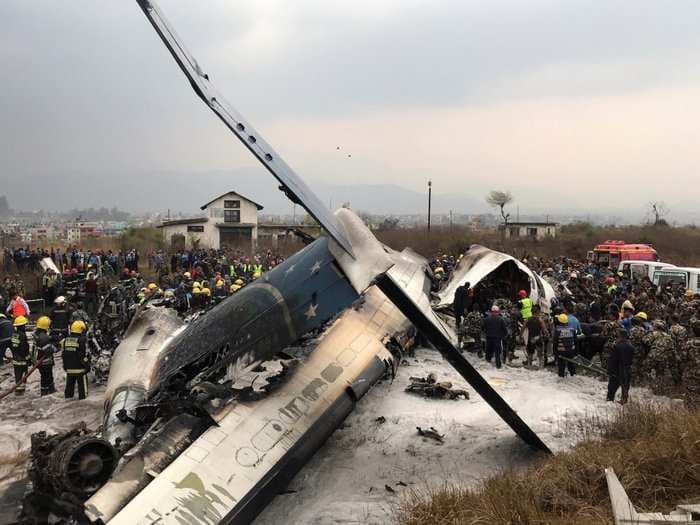 At least 38 dead after a plane crash-landed and burst into flames at an airport in Nepal