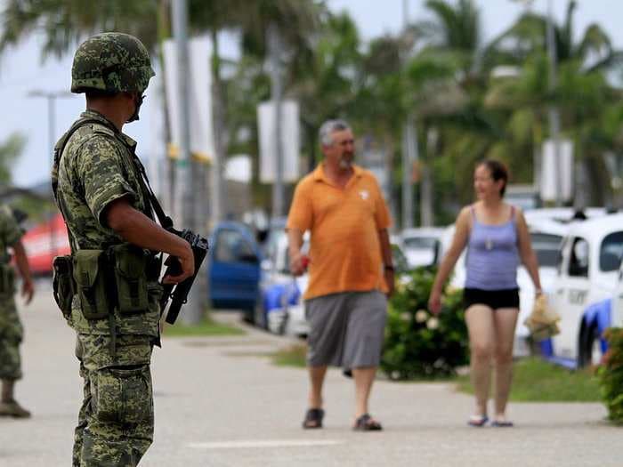 Hundreds of schools have shut down in a Mexican tourist haven after bandits broke in and forcibly cut students' hair