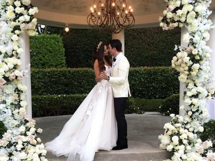 Inside the lavish wedding of former Miss Universe Australia and her artist fiance, complete with a Swarovski crystal-encrusted couture gown and a pair of white Rolls-Royces