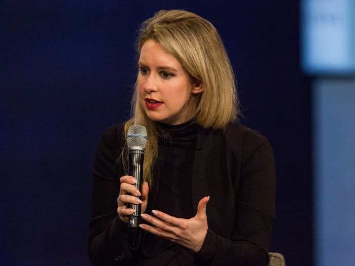 Leaked video shows Theranos employees playing the video game they created where you shoot at the reporter who exposed the startup's problems