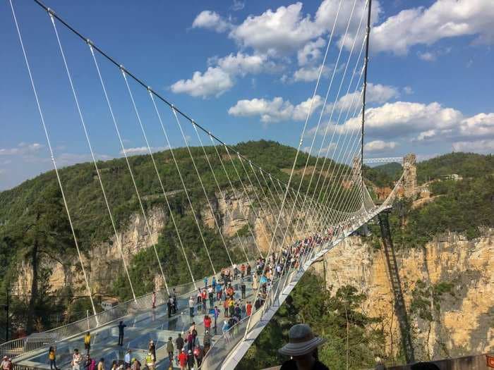 The glass bridge across China's 'Grand Canyon' is a trippy architectural marvel that's all over Instagram - but in real life, it's a tourist's worst nightmare