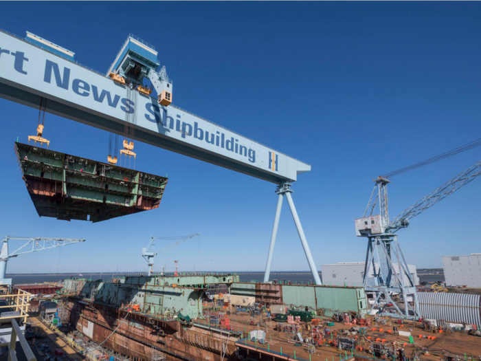 The US Navy's next advanced aircraft carrier is 75% complete - watch the latest 827-ton chunk drop into place