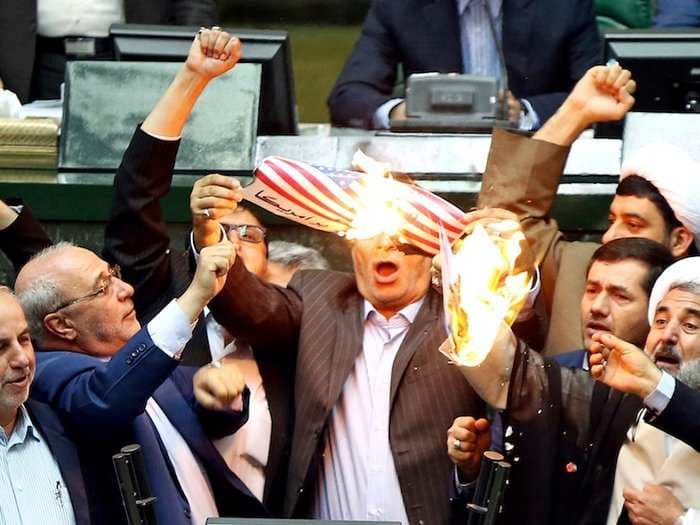 Iranian politicians set the US flag on fire and chanted 'death to America' after Trump pulled out of the Iran deal
