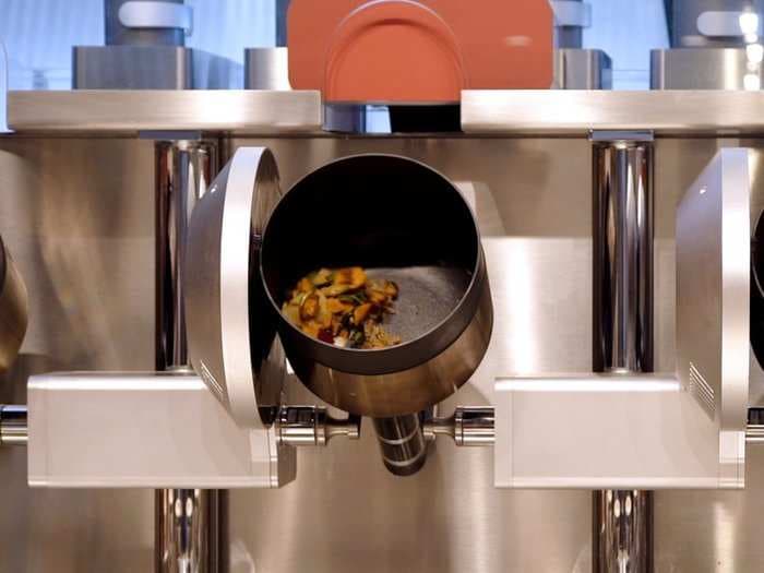 Four MIT graduates created a restaurant with a robotic kitchen that cooks your food in three minutes or less