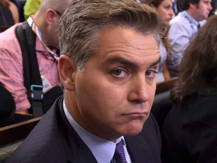 CNN's Jim Acosta describes the bizarre scene as he was heckled and asked for selfies at Trump's fiery rally