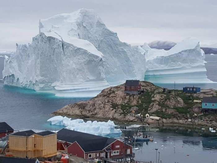 A 300-foot high iceberg is approaching Greenland, and this photo is the latest sign that Mother Nature has had it