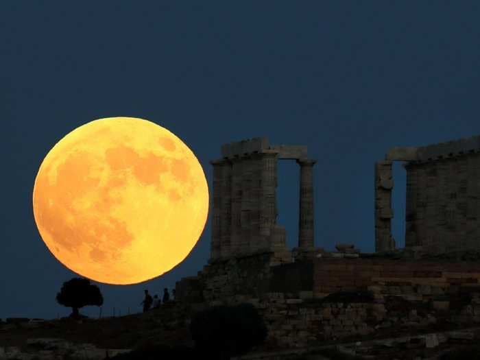 See stunning photos of the longest 'blood moon' lunar eclipse of the century that swept across the Eastern Hemisphere