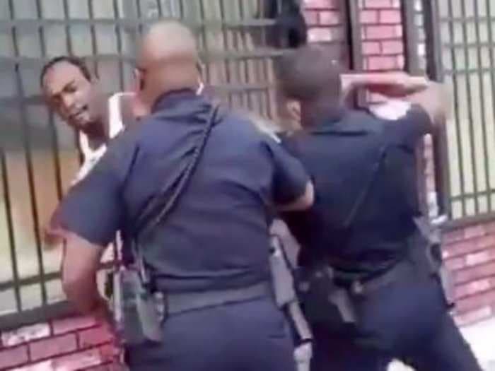 A Baltimore police officer has been put on paid leave after he was filmed repeatedly punching a man and knocking him to the ground