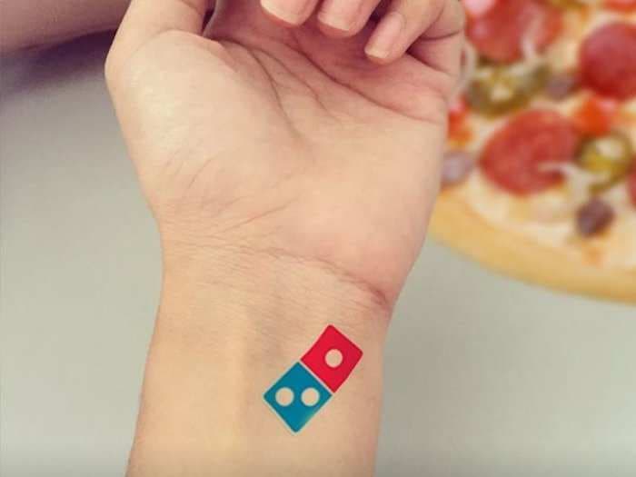 Domino's offered Russians a lifetime of pizzas if they got tattoos of the company logo - and then they had to shut down the offer because too many people got inked