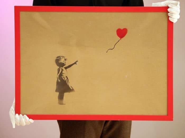 Banksy booby-trapped one of his paintings to self-destruct in this bizarre auction prank