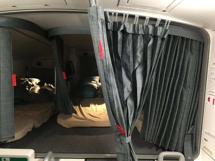 Check out the secret compartment where flight attendants sleep on the longest flight in the world