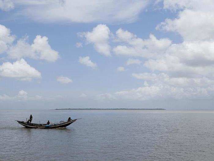 An island in India is disappearing, but some of the last residents say they can't afford to move away