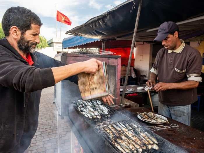 After a $500 meal at the world's most luxurious hotel, I stumbled across a $1 fish restaurant on the Moroccan coast - and I'd pick the cheaper one every time