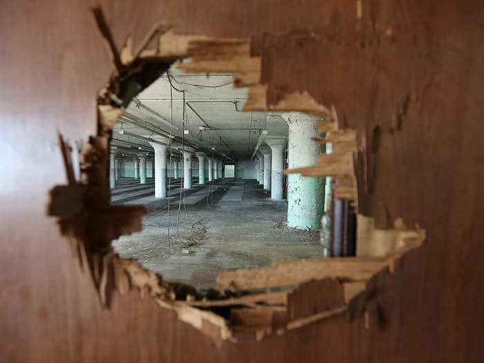 Photos show how an abandoned Sears building transformed into a 'vertical village' of shops and apartments