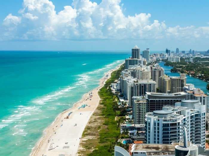 Wealthy New Yorkers and Californians might be fleeing to Miami to find lower taxes - but there still aren't enough buyers to fill up Miami's condo glut
