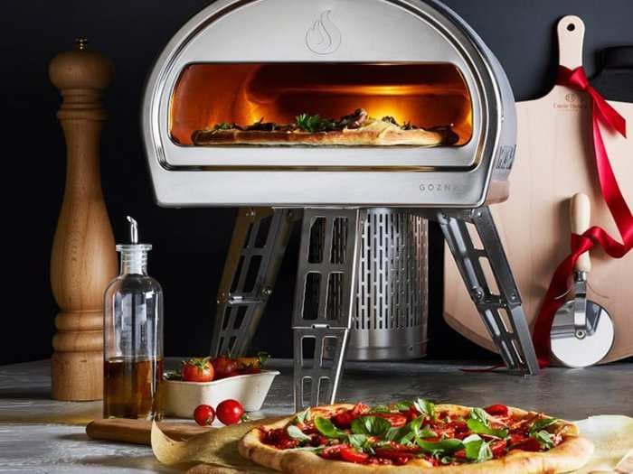 This $700 pizza oven gets up to 900 degrees Fahrenheit in 15 minutes and cooks pizzas in 60 seconds - here's what it's like to use