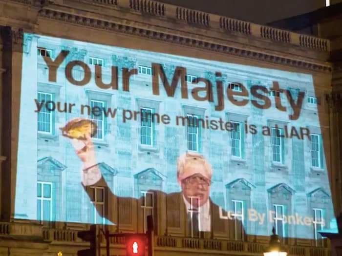 'Your new prime minister is a liar': Protest message to the Queen projected onto Buckingham Palace