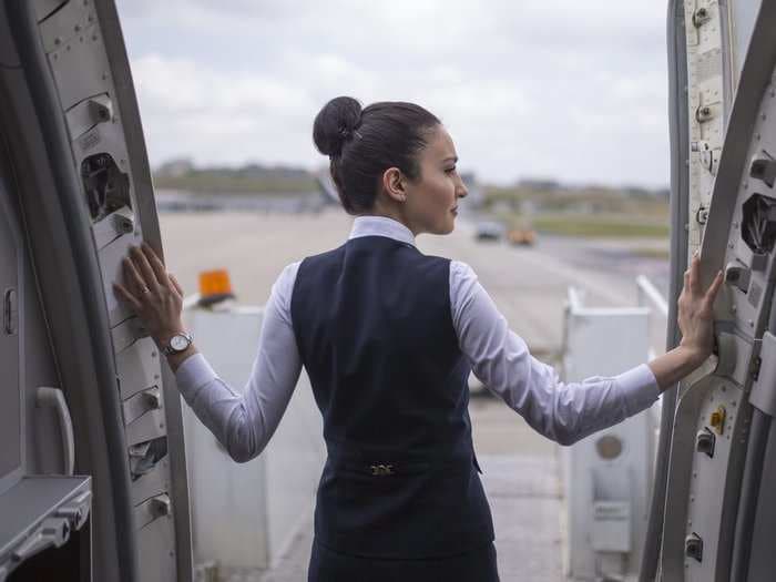 Flight attendants reveal one of the worst parts of their job - they don't always get paid for all of the hours they work