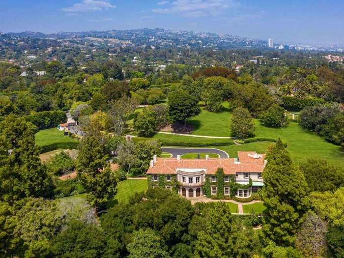 A 'legendary' estate that was once the largest private residence in Los Angeles is back on the market with a $65 million price chop. Here's a look inside the historic luxury home that was previously owned by Sonny and Cher and neighbors the Playboy Mansion.