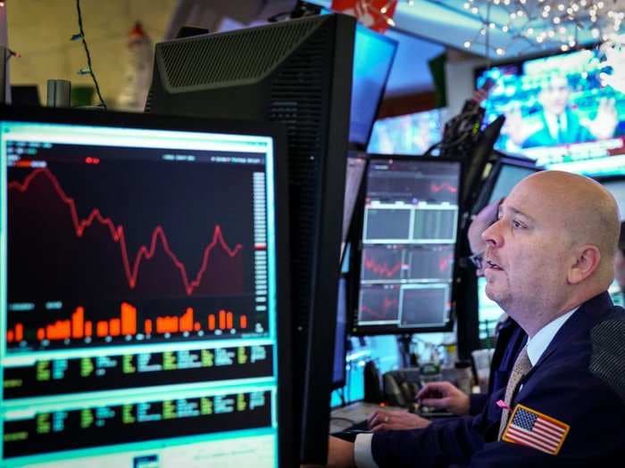 Stocks finish mixed as traders weigh weak economic data ahead of Fed speech