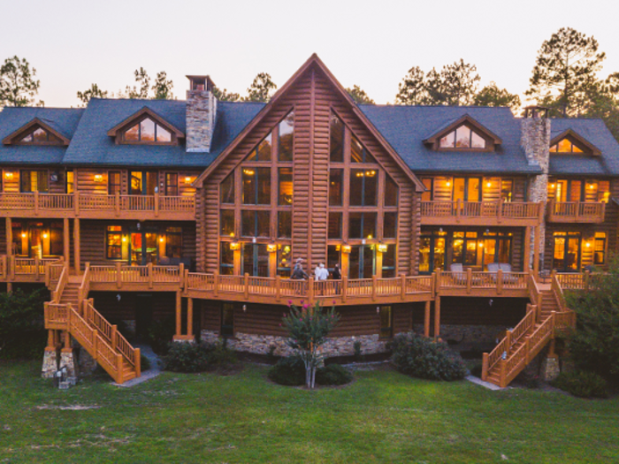 See inside one of the largest 'log homes' in the US: a $9.5 million mansion that comes with a temperature controlled 22-car garage