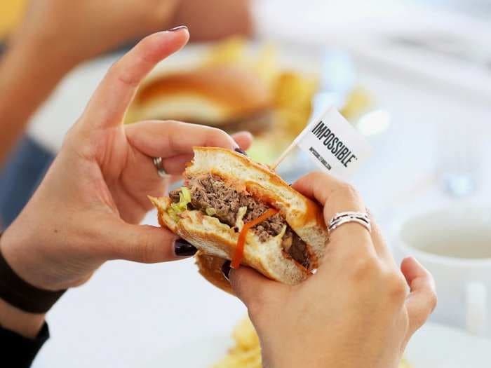 The Impossible Burger is hitting grocery store shelves in a direct play for Beyond Meat's retail turf